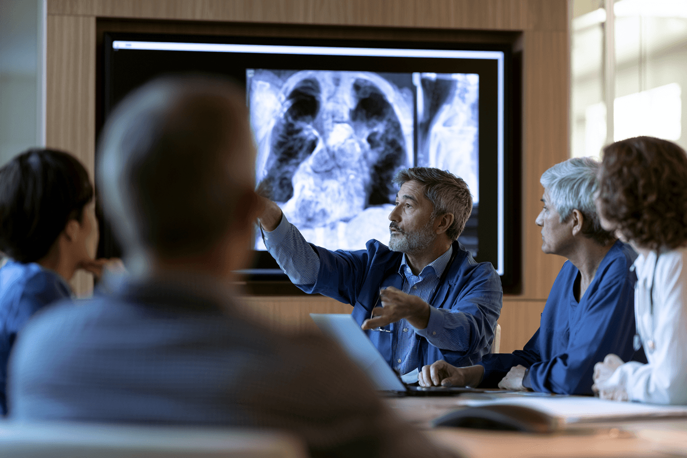 Multidisciplinary cancer team deciding when radiation and chemotherapy are appropriate for anaplastic thyroid cancer.