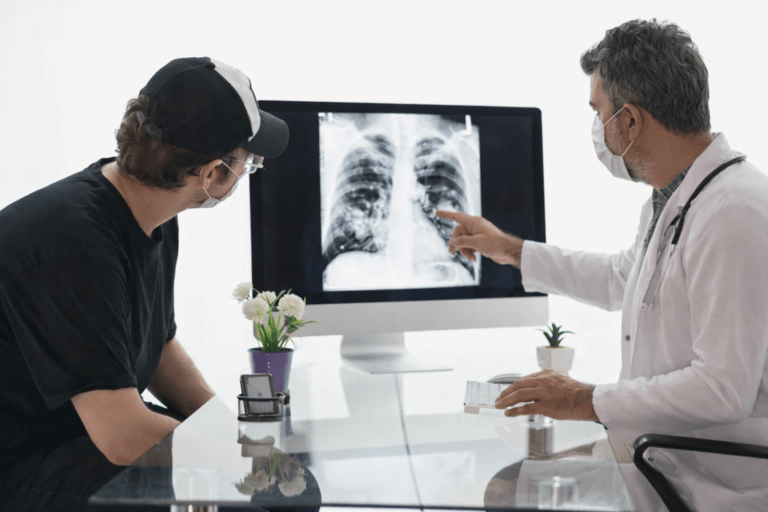Doctor explaining lung cancer CT scan to patient during clinical consultation for treatment decision