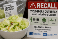 Home 6 Cyclospora lettuce outbreak 2026 recall warning beside packaged iceberg lettuce and a fresh salad