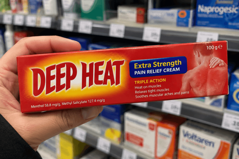 Deep Heat recall illustration showing a hand holding a 100g box of Extra Strength pain relief cream in a pharmacy.