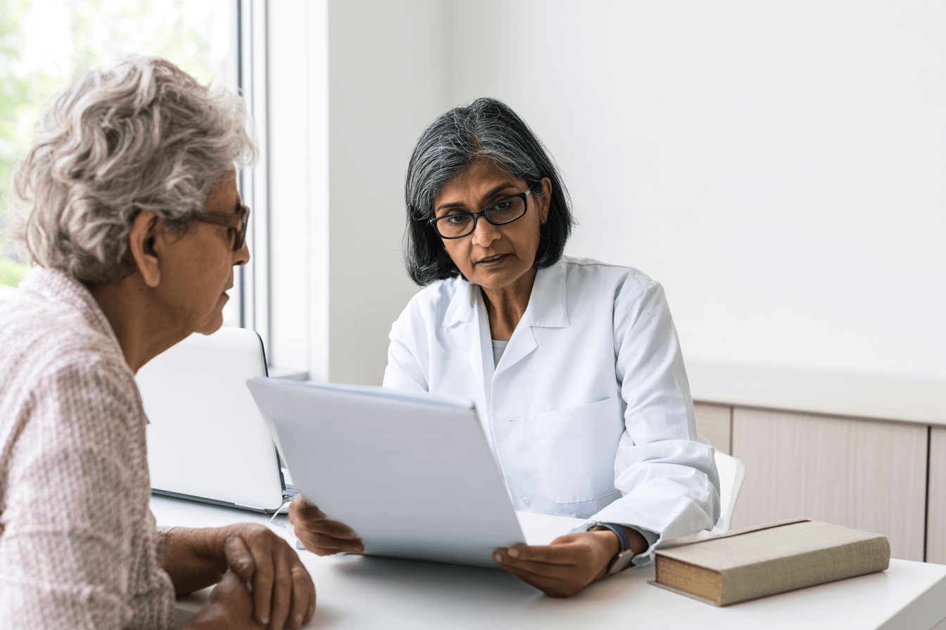 Stage 4 Esophageal Cancer: Symptoms, Survival And What To Expect 4 Ayurvedic practitioner reviewing medical reports and current medicines with a patient.