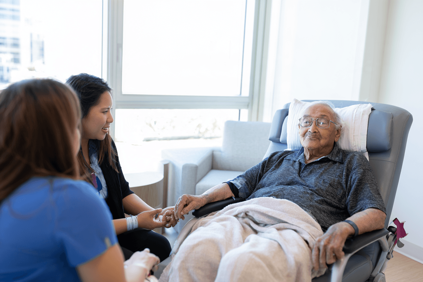 Stage 4 Esophageal Cancer: Symptoms, Survival And What To Expect 8 Nurse speaking with a patient and family member during a supportive-care visit at home.