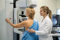 Home 7 Fda mammogram quality problems showing a patient receiving breast screening with a radiology technician at a certified mammography facility.
