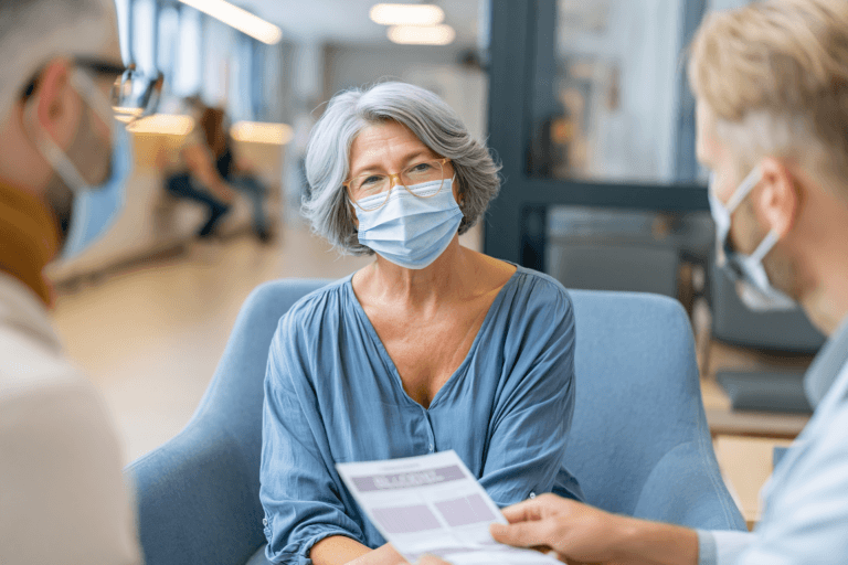 Doctor discussing long COVID immune dysfunction symptoms including fatigue and brain fog with a patient during a medical consultation.