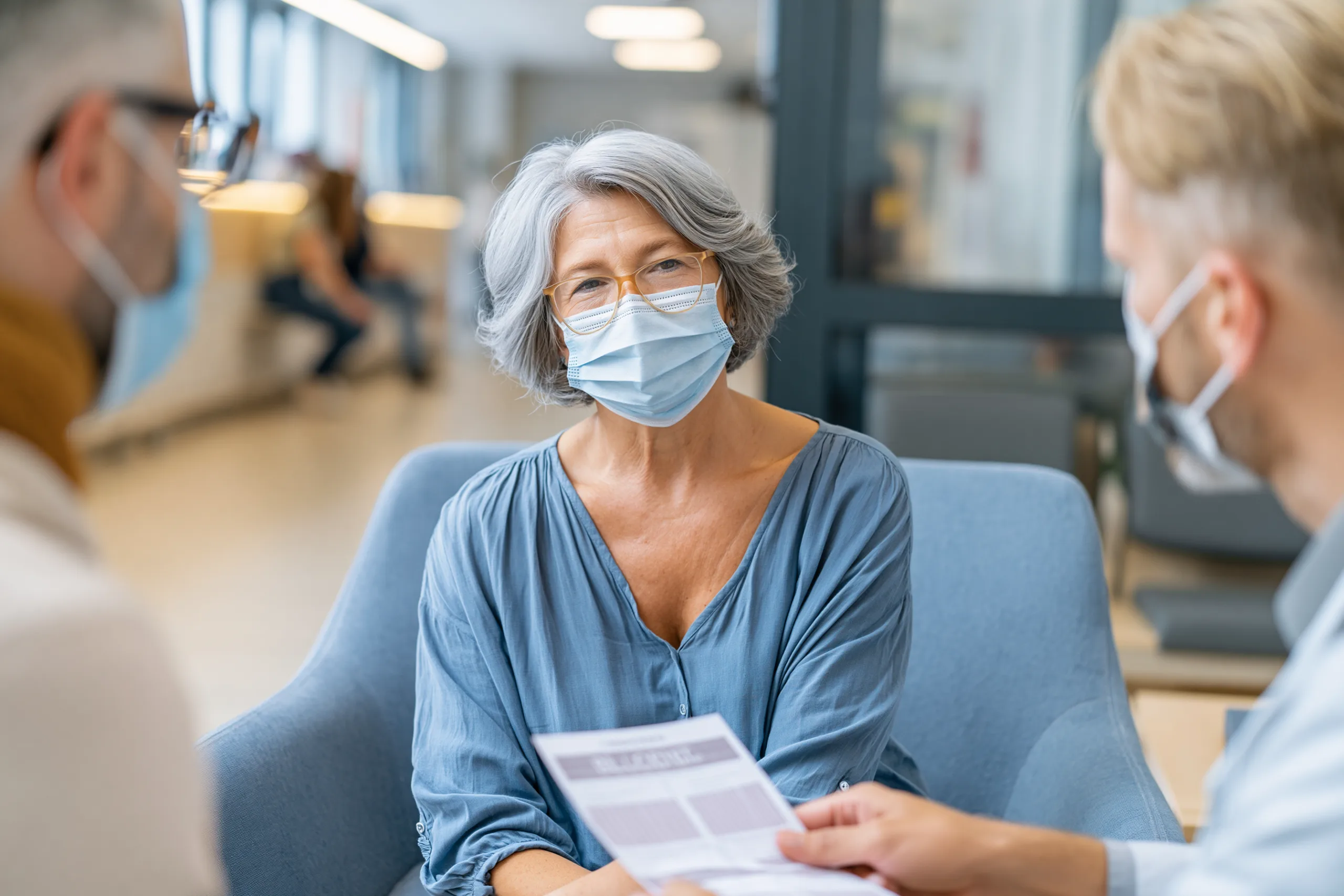 Doctor discussing long covid immune dysfunction symptoms including fatigue and brain fog with a patient during a medical consultation.