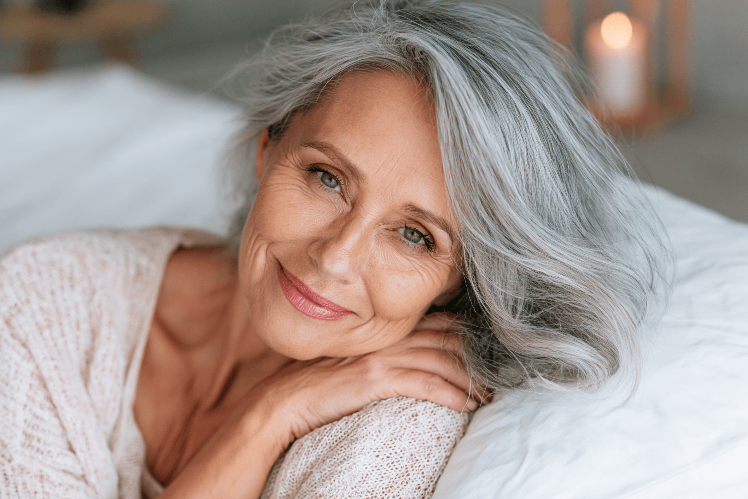 Home 5 Woman discussing menopause hormone therapy with doctor while reviewing hormone health and healthy aging options.