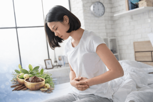 Woman holding lower abdomen due to pelvic pain associated with ovarian cystadenofibroma and chronic salpingitis