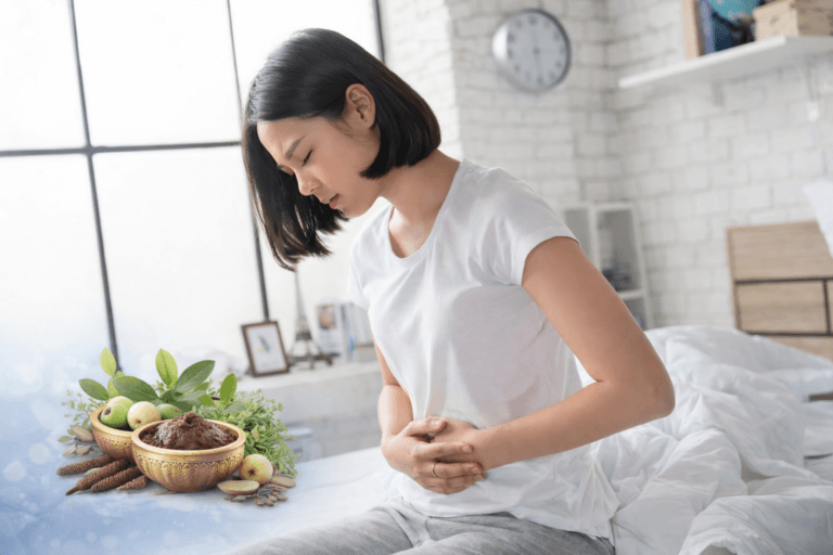 Woman holding lower abdomen due to pelvic pain associated with ovarian cystadenofibroma and chronic salpingitis