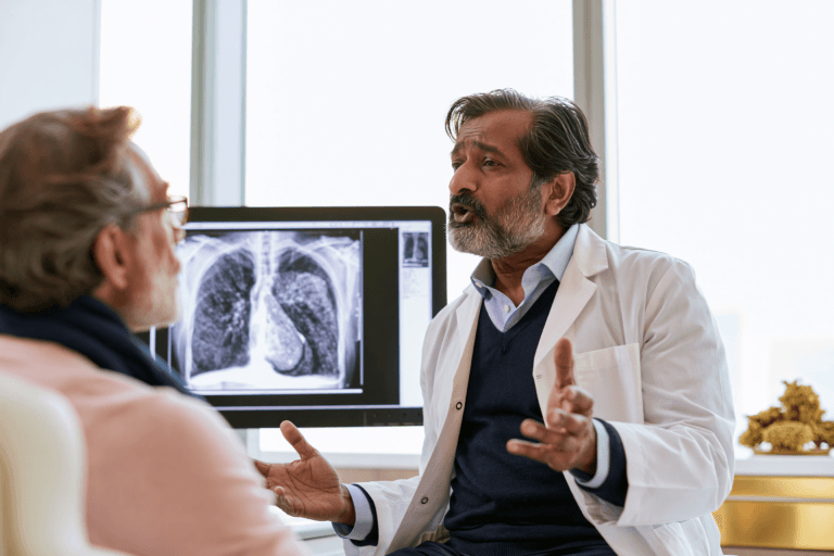 Pleural mesothelioma treatment consultation with a doctor reviewing a chest ct scan with a patient