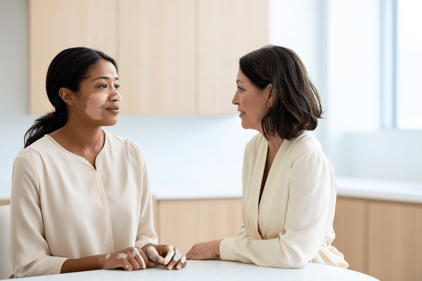 Can Vitiligo Be Cured Permanently? Treatment Results And Ayurveda 2 Clinician examining vitiligo patches on a woman’s cheek and hands.